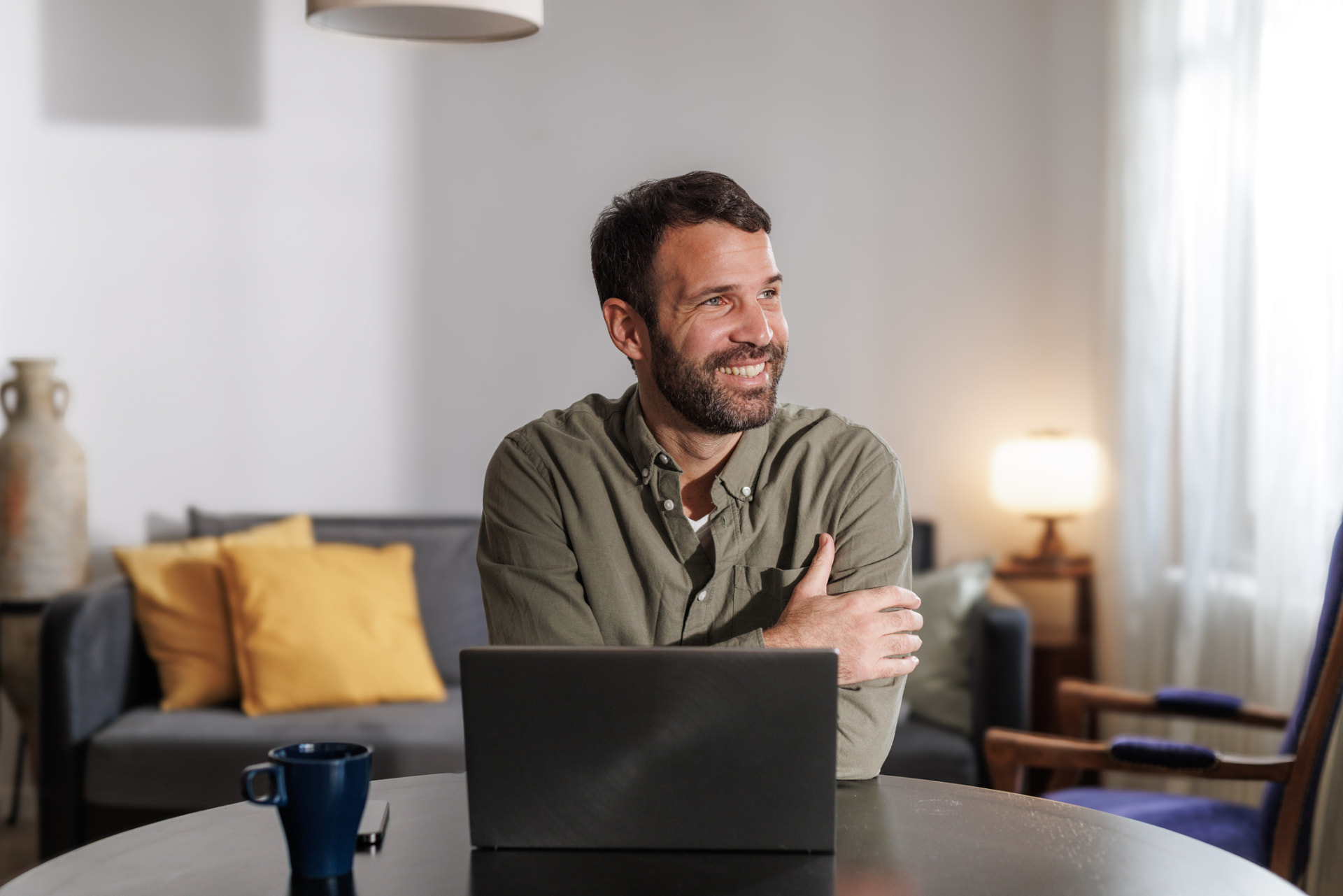 Man meeting with his clinician by video visit from his living room